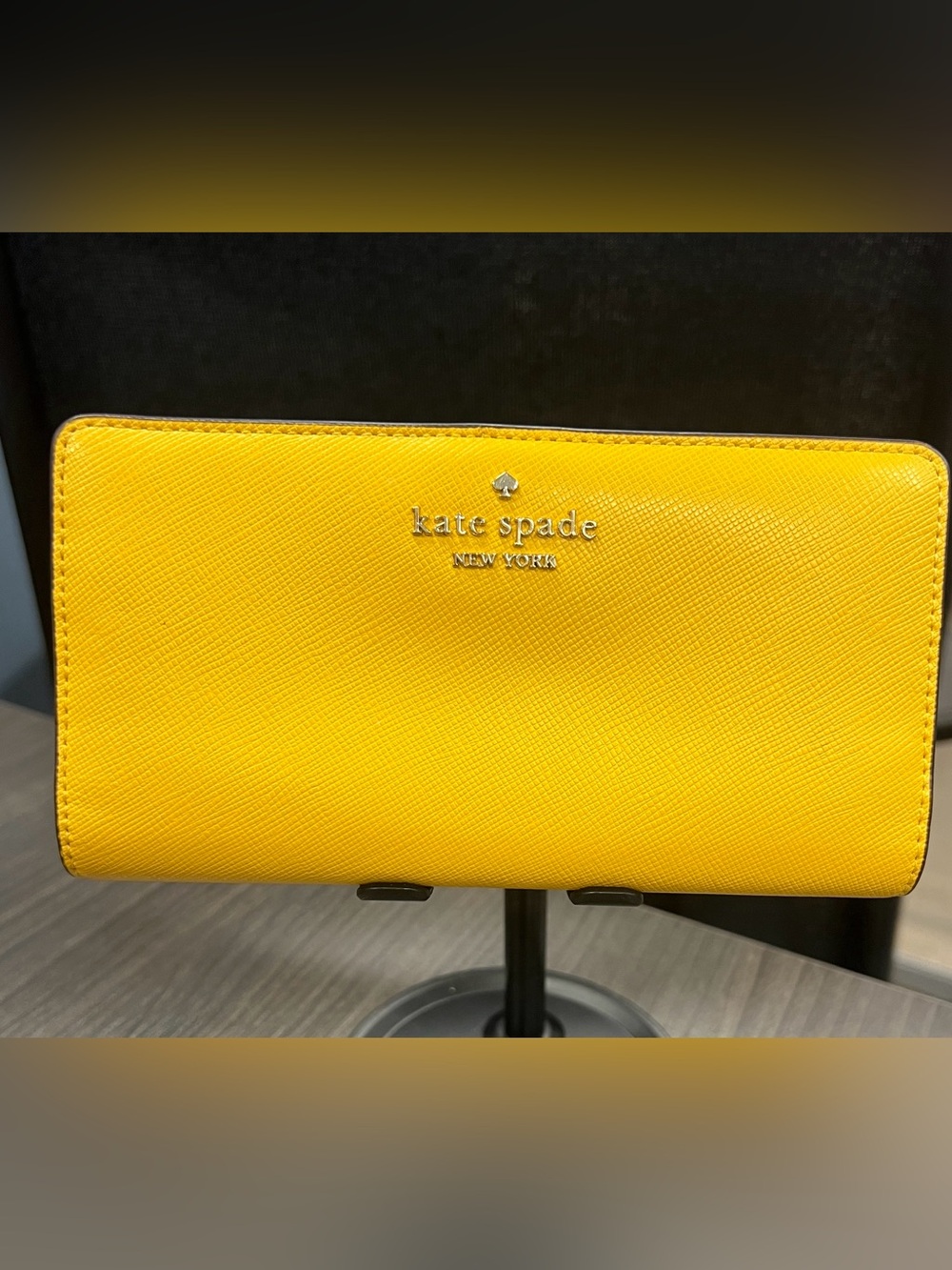 Kate Spade Madison Large Slim Bi-fold Wallet in the color Daffodil